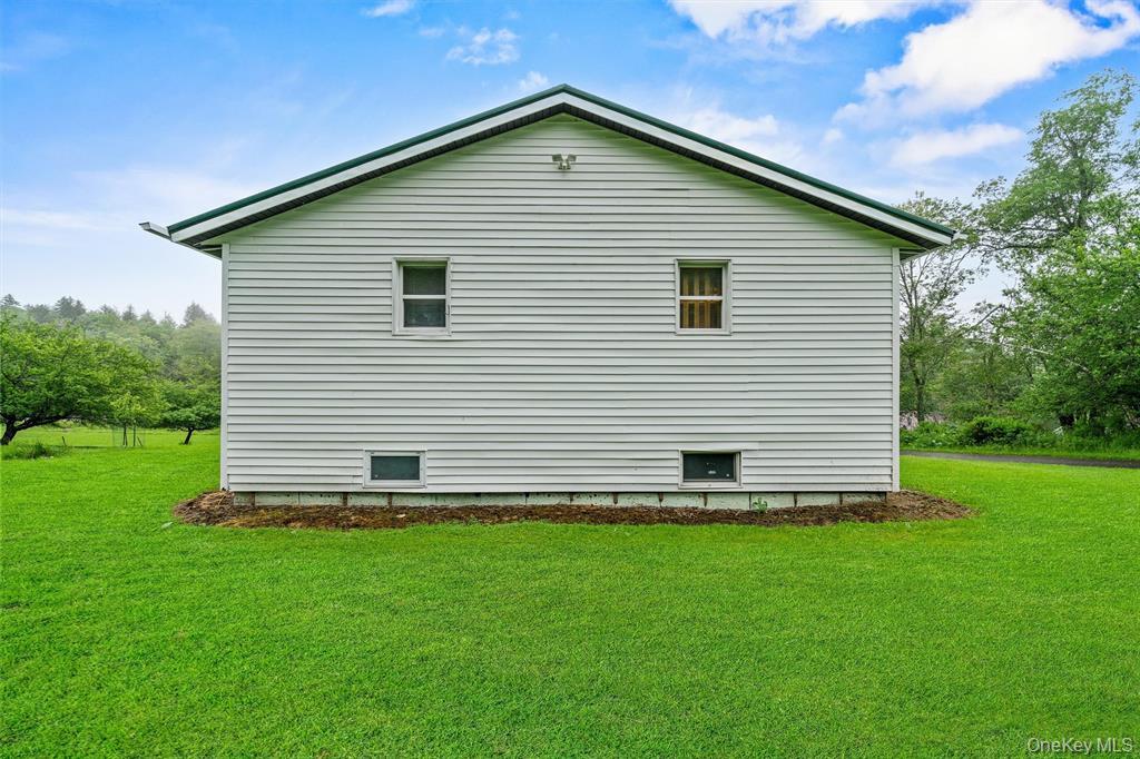 1013 Cooley Road Parksville, NY 12768 - Photo 34 of 44 a front view of a house with a yard