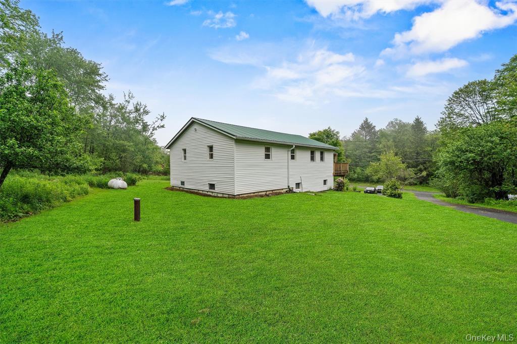 1013 Cooley Road Parksville, NY 12768 - Photo 35 of 44 a view of a house with backyard and garden
