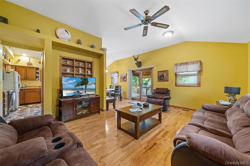 1013 Cooley Road Parksville, NY 12768 - Photo 8 of 44 a living room with furniture ceiling fan and a flat screen tv