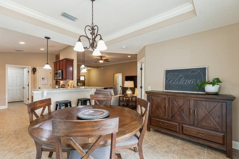 2693 Hartman Court Navarre, FL 32566 - Photo 13 of 34 a view of a dining room with furniture