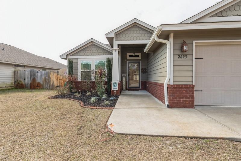 2693 Hartman Court Navarre, FL 32566 - Photo 2 of 34 a view of a house with backyard and porch