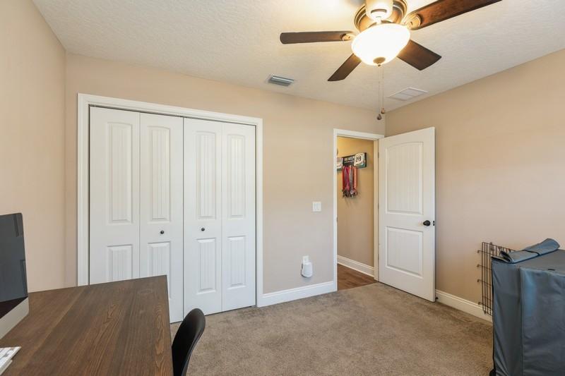 2693 Hartman Court Navarre, FL 32566 - Photo 27 of 34 wooden floor in an empty room