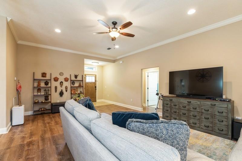 2693 Hartman Court Navarre, FL 32566 - Photo 6 of 34 a living room with furniture and a flat screen tv
