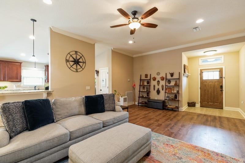 2693 Hartman Court Navarre, FL 32566 - Photo 7 of 34 a living room with furniture and a large window
