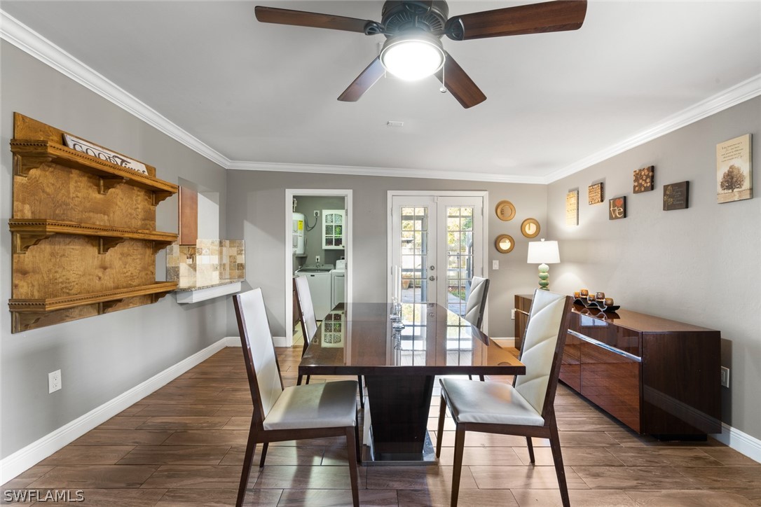 1447 Collins Road Fort Myers, FL 33919 - Photo 15 of 34 a view of a dining room with furniture window and wooden floor