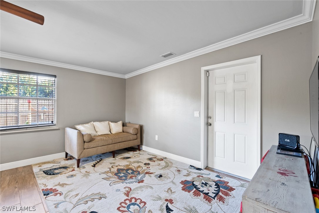 1447 Collins Road Fort Myers, FL 33919 - Photo 17 of 34 a bedroom with a bed and a couch