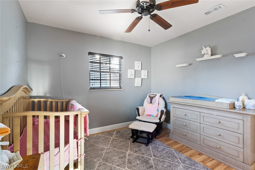 1447 Collins Road Fort Myers, FL 33919 - Photo 20 of 34 a bedroom with furniture and window