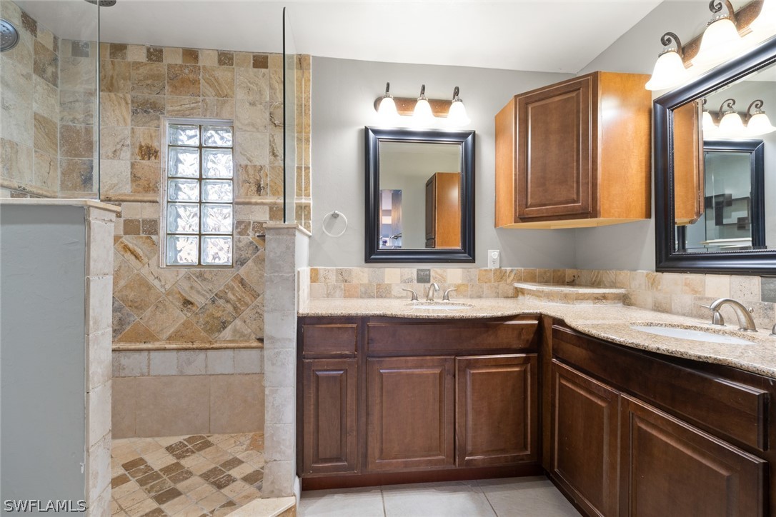 1447 Collins Road Fort Myers, FL 33919 - Photo 27 of 34 a bathroom with a sink and a mirror
