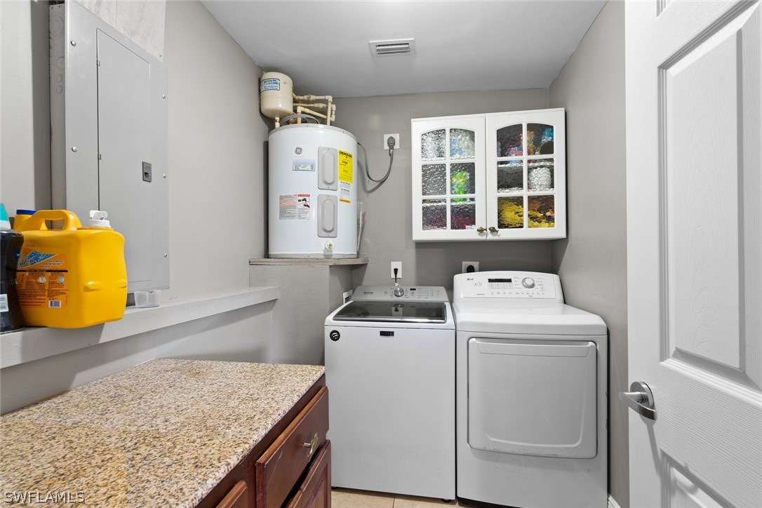 1447 Collins Road Fort Myers, FL 33919 - Photo 28 of 34 a utility room with dryer and washer