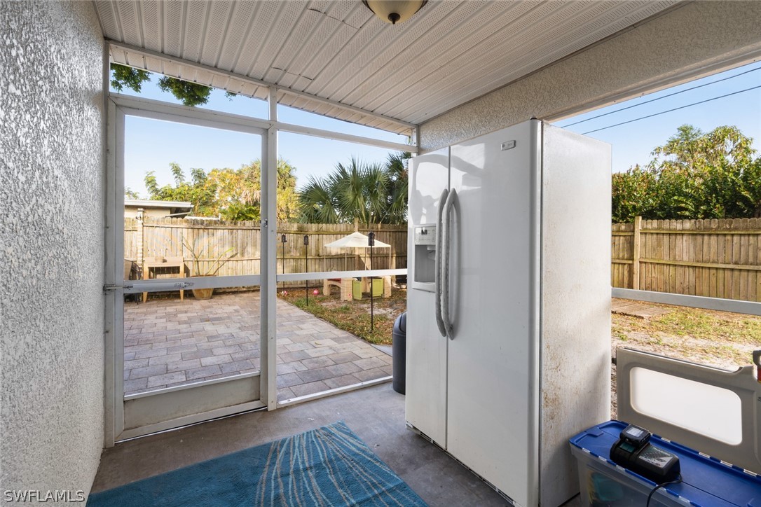 1447 Collins Road Fort Myers, FL 33919 - Photo 29 of 34 a view of a room with wooden floor and door