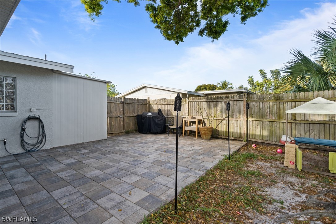 1447 Collins Road Fort Myers, FL 33919 - Photo 31 of 34 a view of a house with a patio