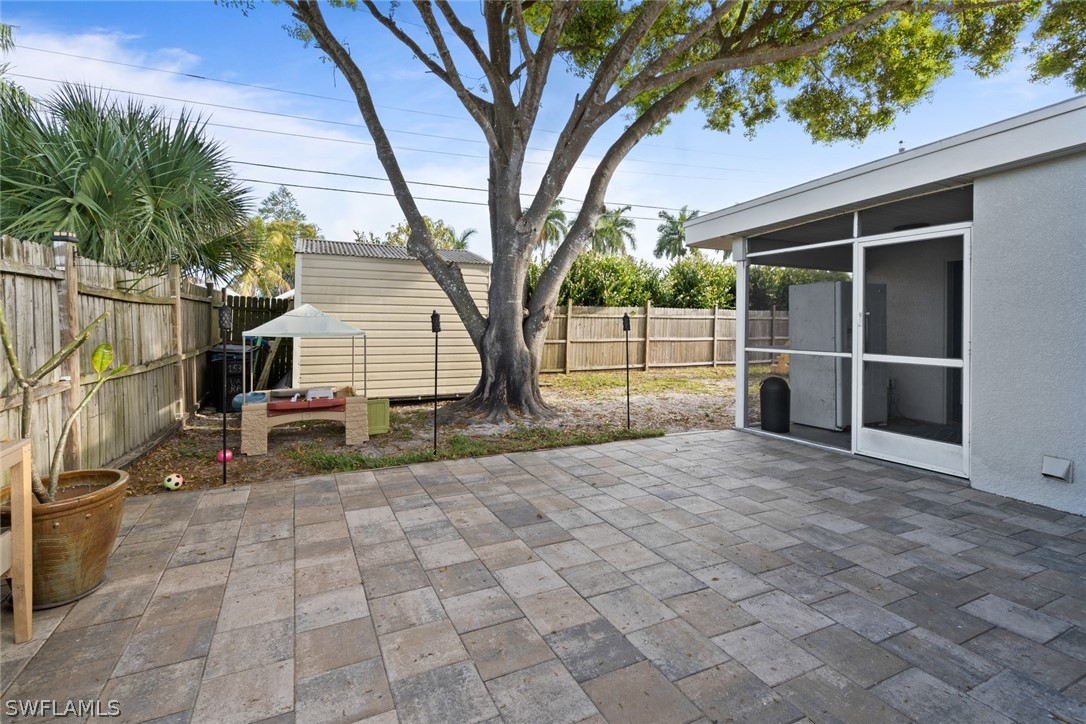 1447 Collins Road Fort Myers, FL 33919 - Photo 32 of 34 a view of a backyard with a large tree