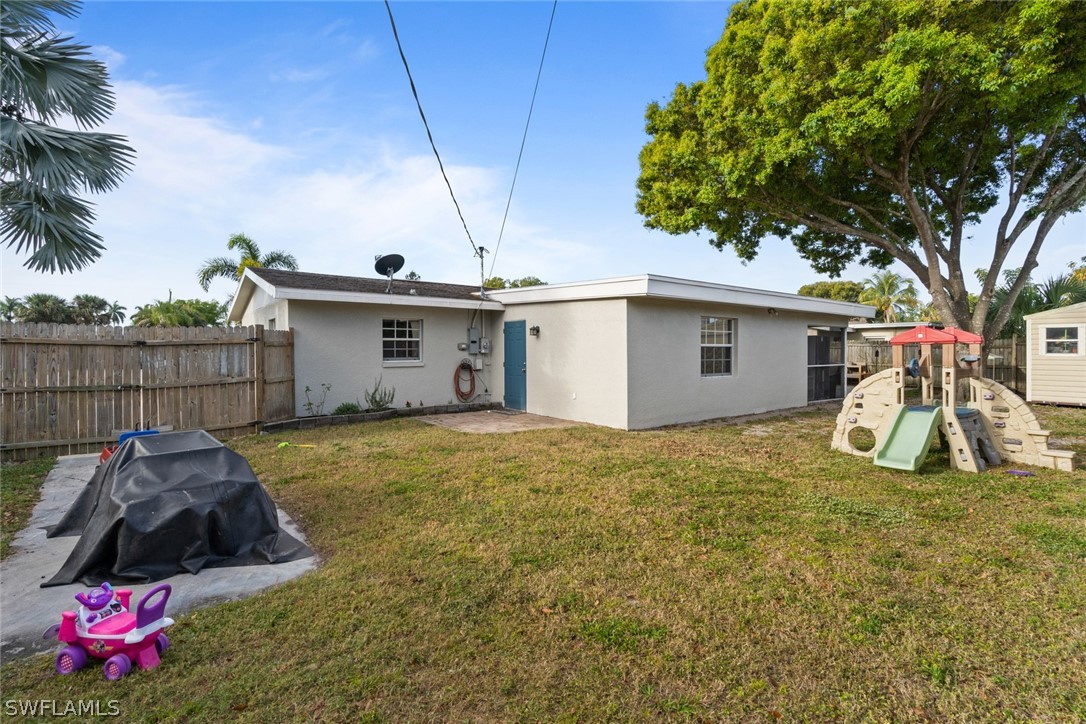 1447 Collins Road Fort Myers, FL 33919 - Photo 34 of 34 a view of a house with backyard and entertaining space