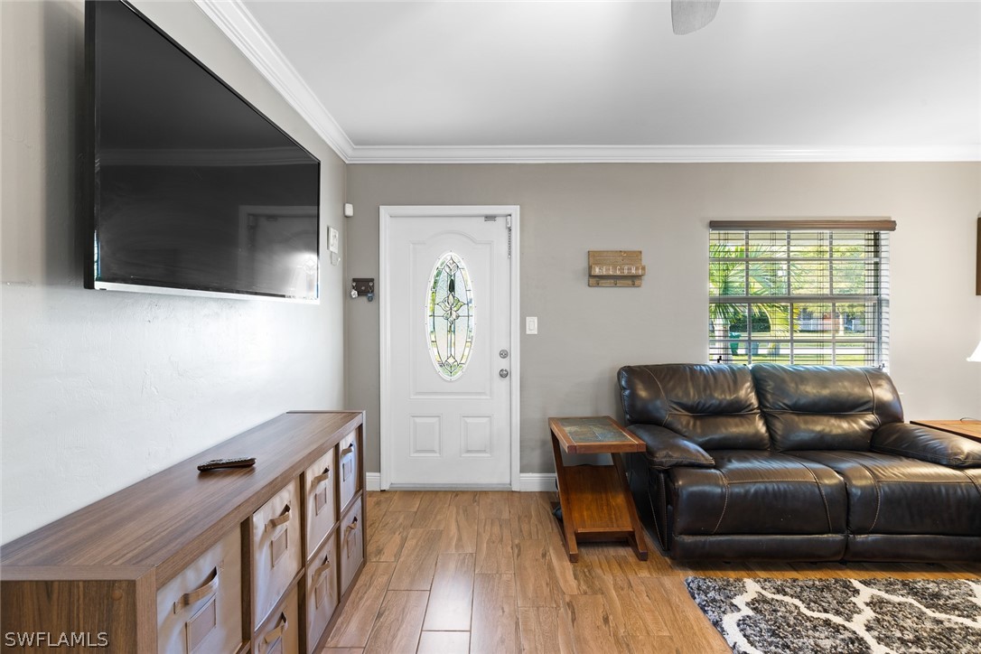 1447 Collins Road Fort Myers, FL 33919 - Photo 7 of 34 a living room with furniture and a flat screen tv