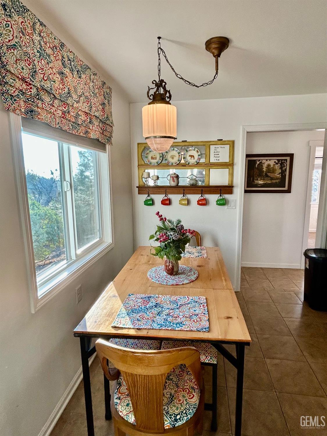 Undisclosed Address Posey, CA 93260 - Photo 13 of 39 a view of a dining room with furniture window and wooden floor