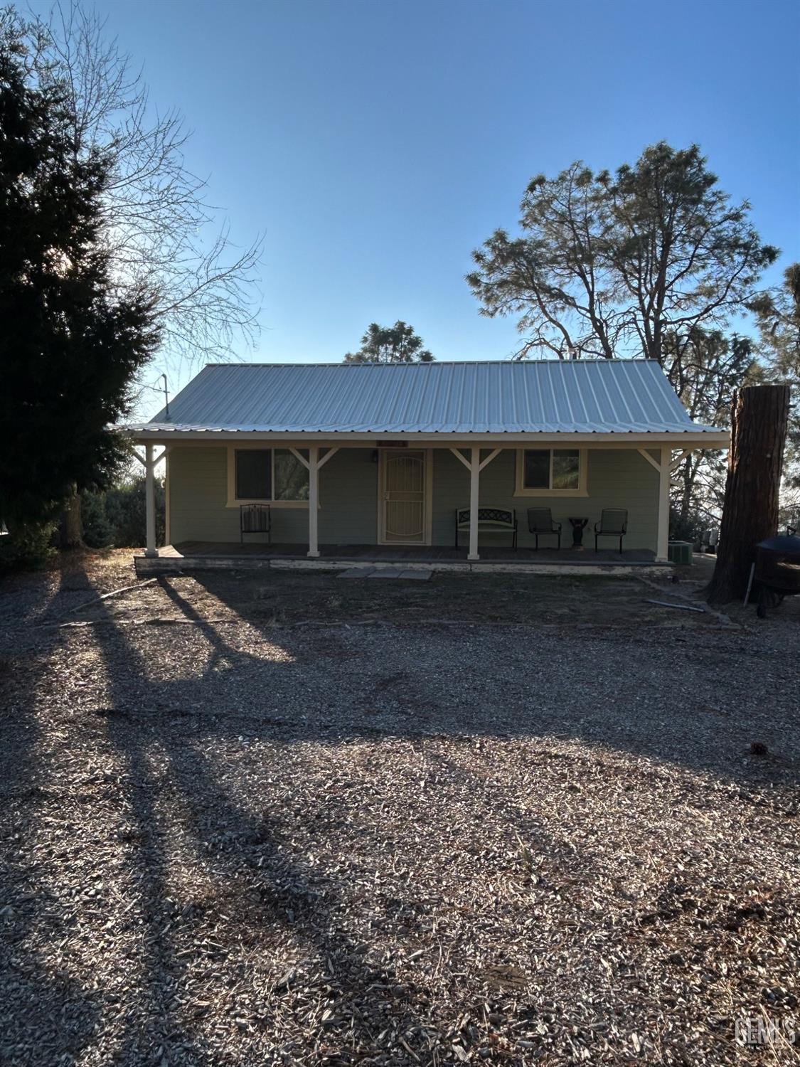 Undisclosed Address Posey, CA 93260 - Photo 2 of 39 a front view of a house with a yard