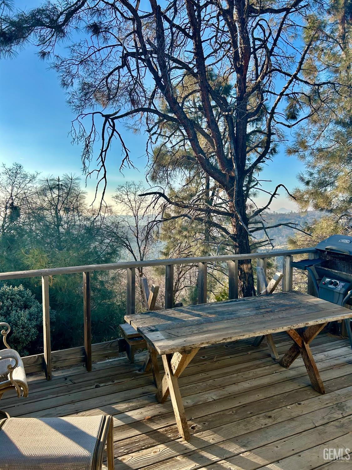 Undisclosed Address Posey, CA 93260 - Photo 30 of 39 a backyard of a house with wooden floor and outdoor seating