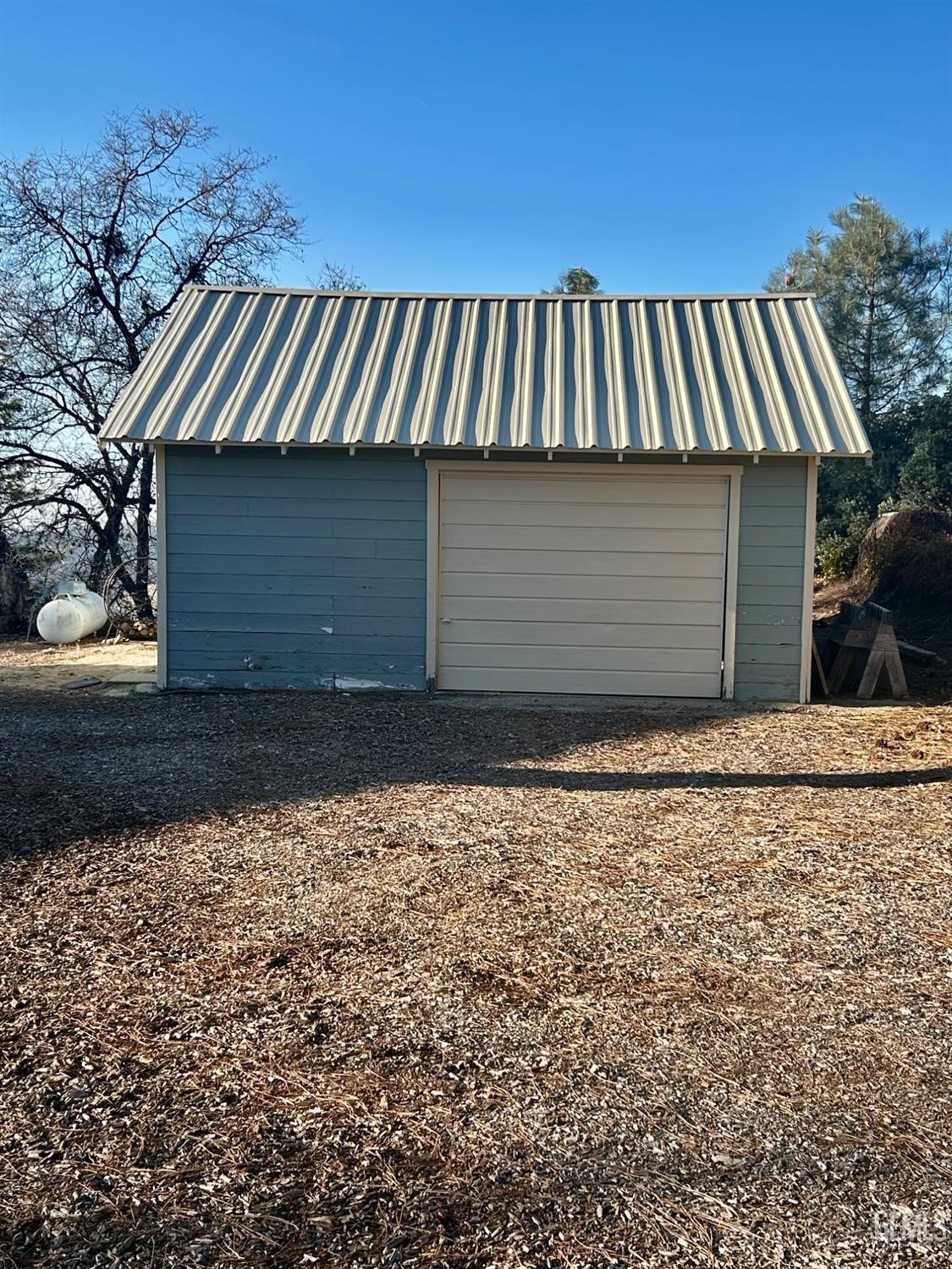 Undisclosed Address Posey, CA 93260 - Photo 36 of 39 a view of a house with a garage