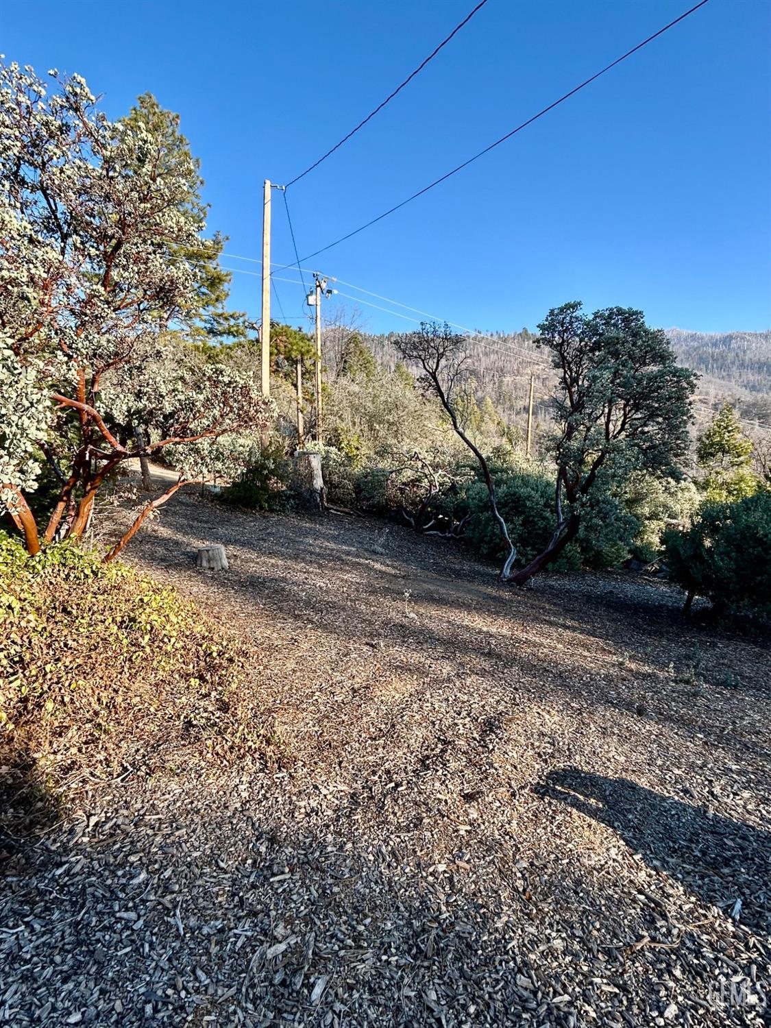 Undisclosed Address Posey, CA 93260 - Photo 37 of 39 a view of a road with a building in the background