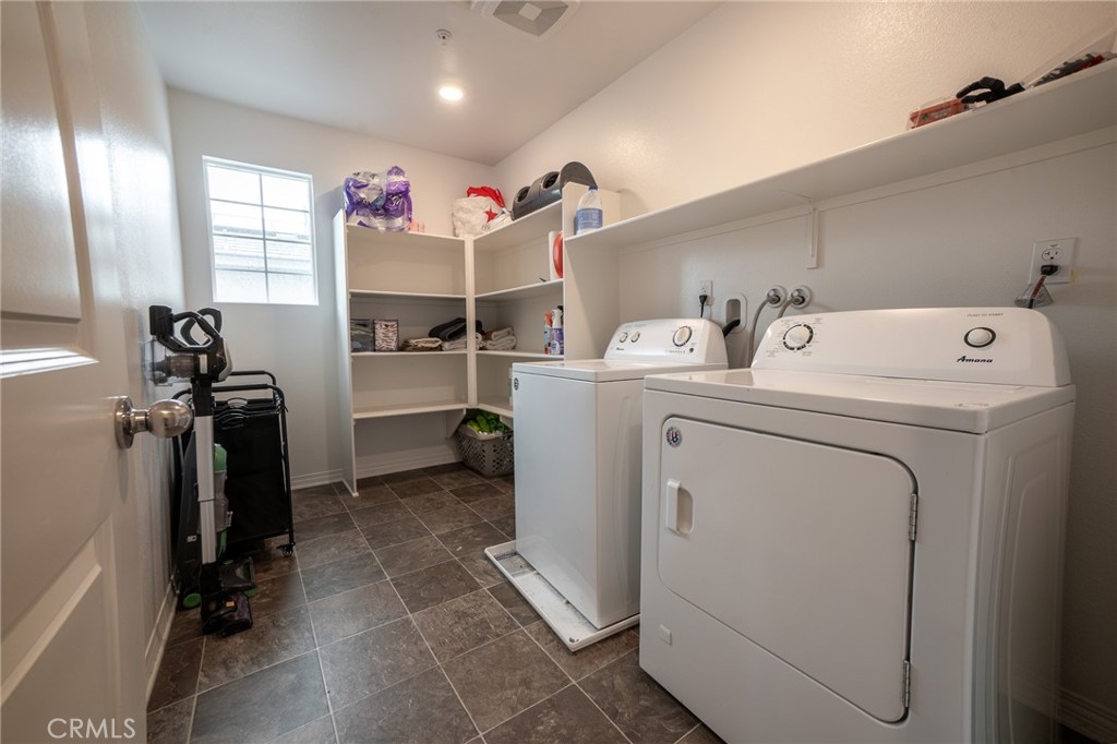 2464 Gunner Ridge Way Rialto, CA 92377 - Photo 19 of 42 a storage room with washer and dryer