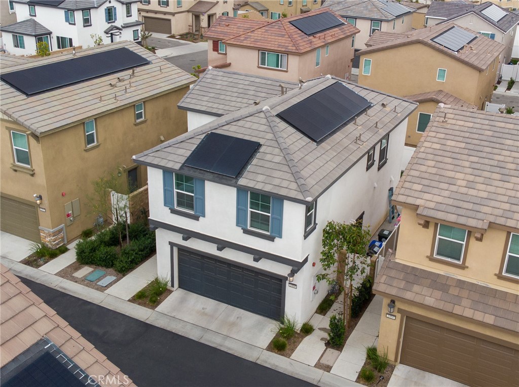 2464 Gunner Ridge Way Rialto, CA 92377 - Photo 21 of 42 a aerial view of a house with a yard