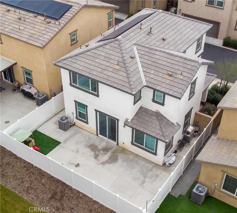 2464 Gunner Ridge Way Rialto, CA 92377 - Photo 22 of 42 front view of a house with a street