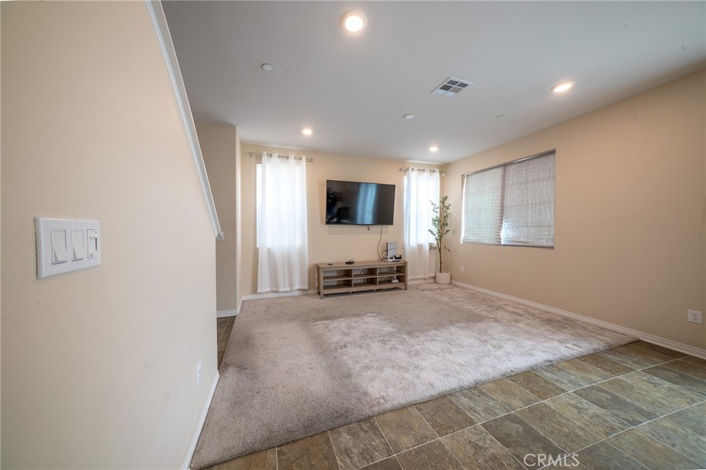 2464 Gunner Ridge Way Rialto, CA 92377 - Photo 10 of 42 a view of a livingroom with a flat screen tv