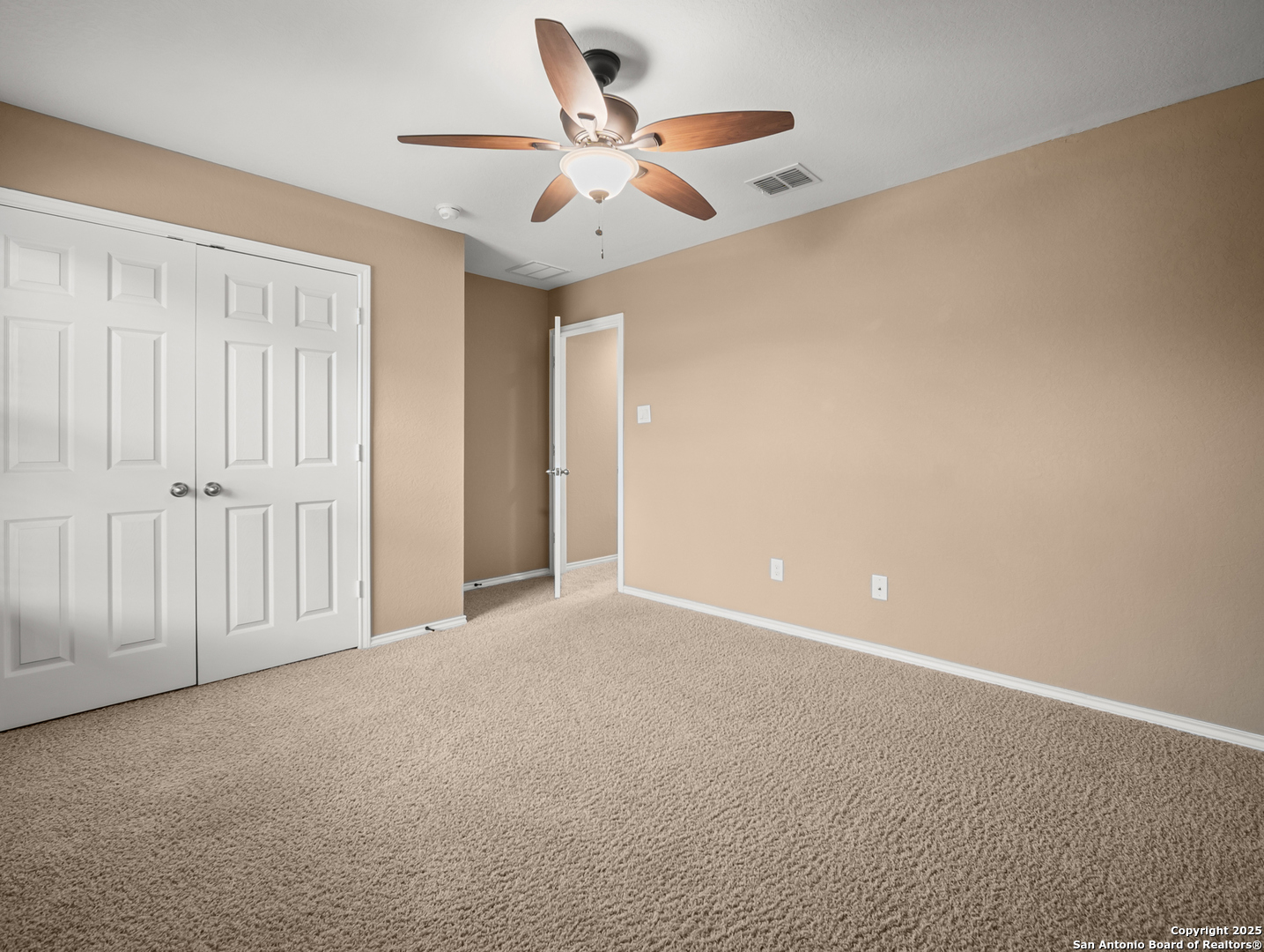 7514 Copper Cove Converse, TX 78109 - Photo 24 of 33 an empty room with ceiling fan and window