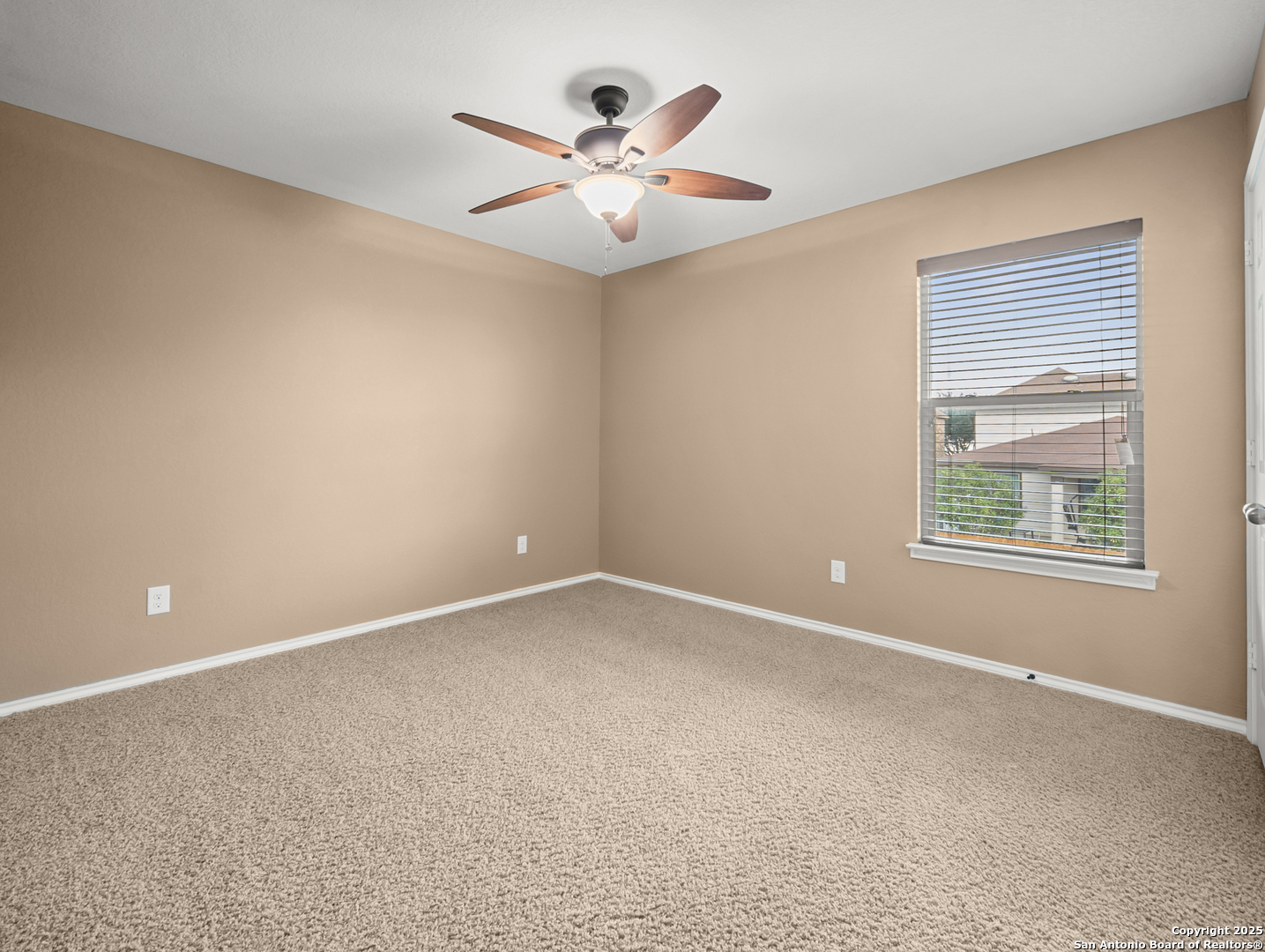 7514 Copper Cove Converse, TX 78109 - Photo 25 of 33 an empty room with window and ceiling fan