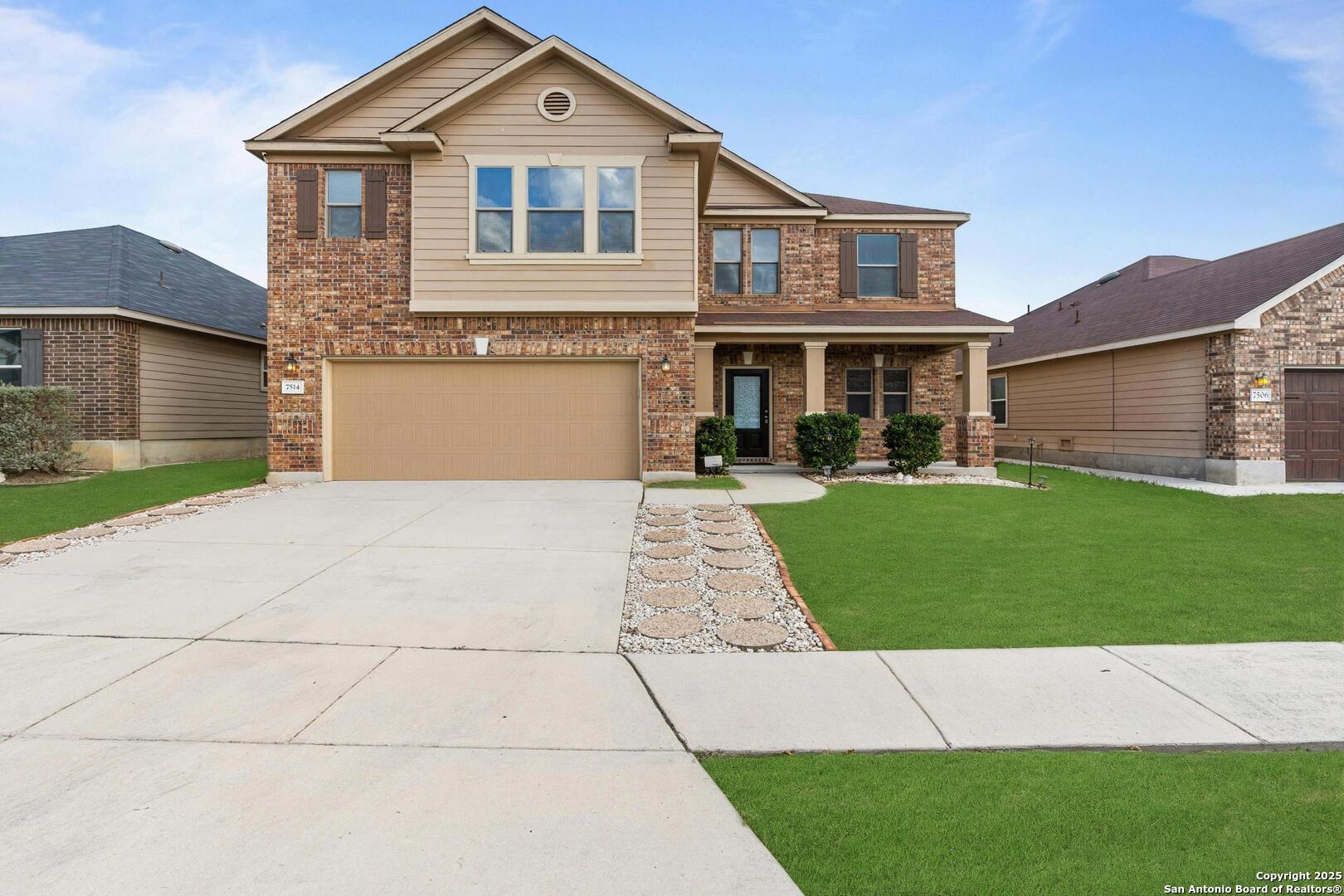 7514 Copper Cove Converse, TX 78109 - Photo 3 of 33 a front view of a house with a yard and garage