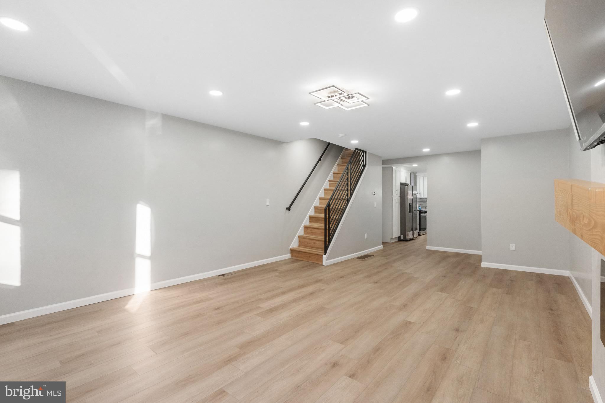 1203 Moore Street Philadelphia, PA 19148 - Photo 12 of 41 a view of an empty room with wooden floor