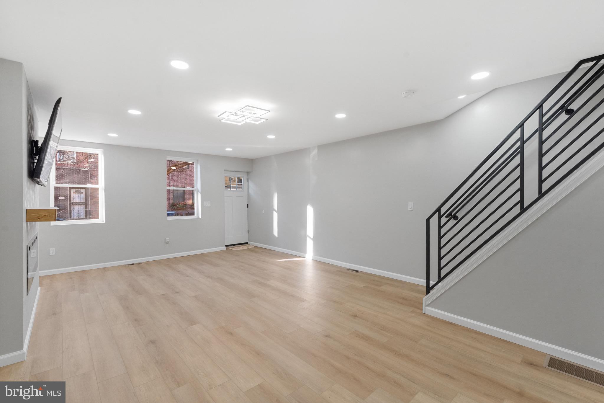 1203 Moore Street Philadelphia, PA 19148 - Photo 13 of 41 an empty room with wooden floor and windows