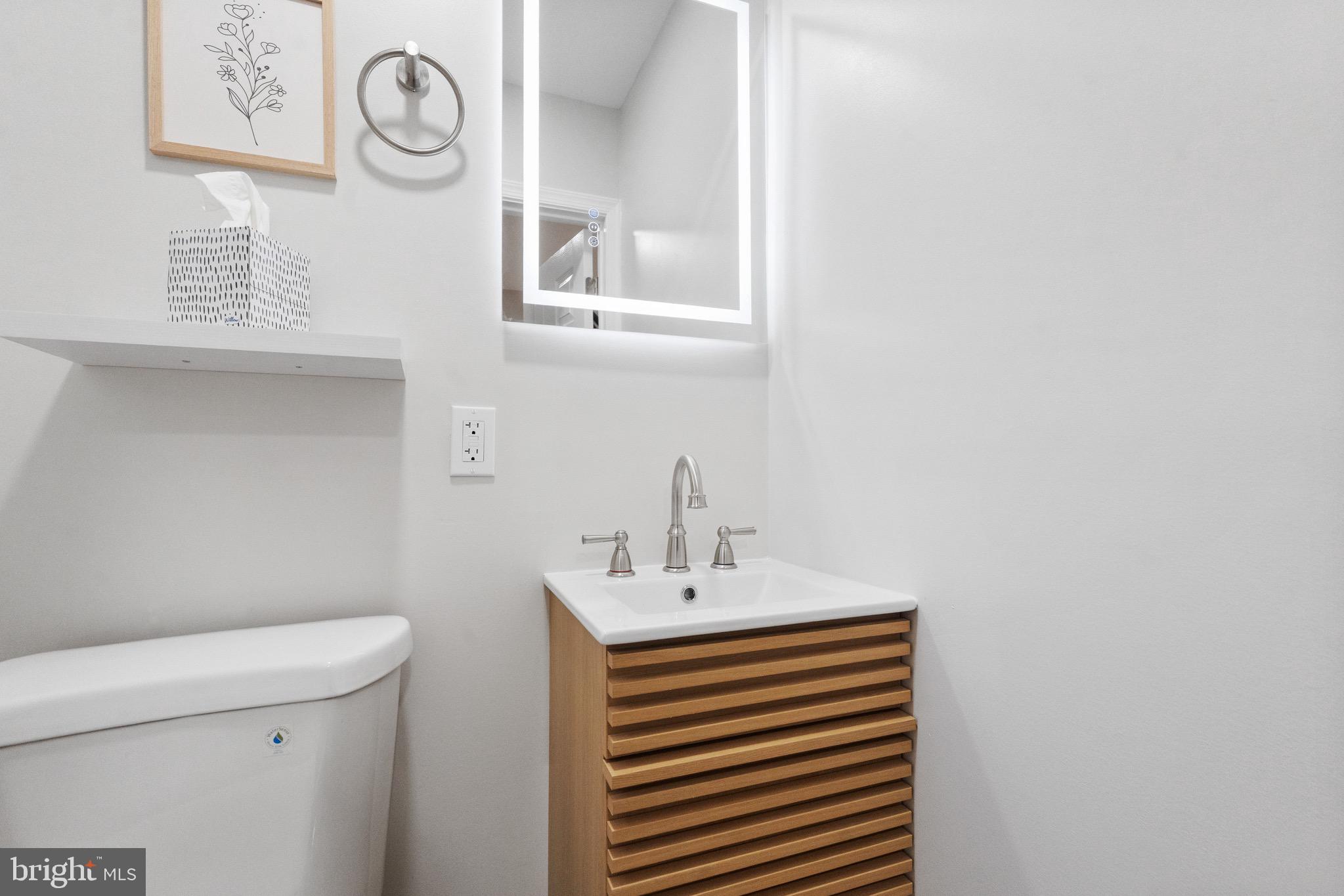 1203 Moore Street Philadelphia, PA 19148 - Photo 37 of 41 a bathroom with a sink and a toilet
