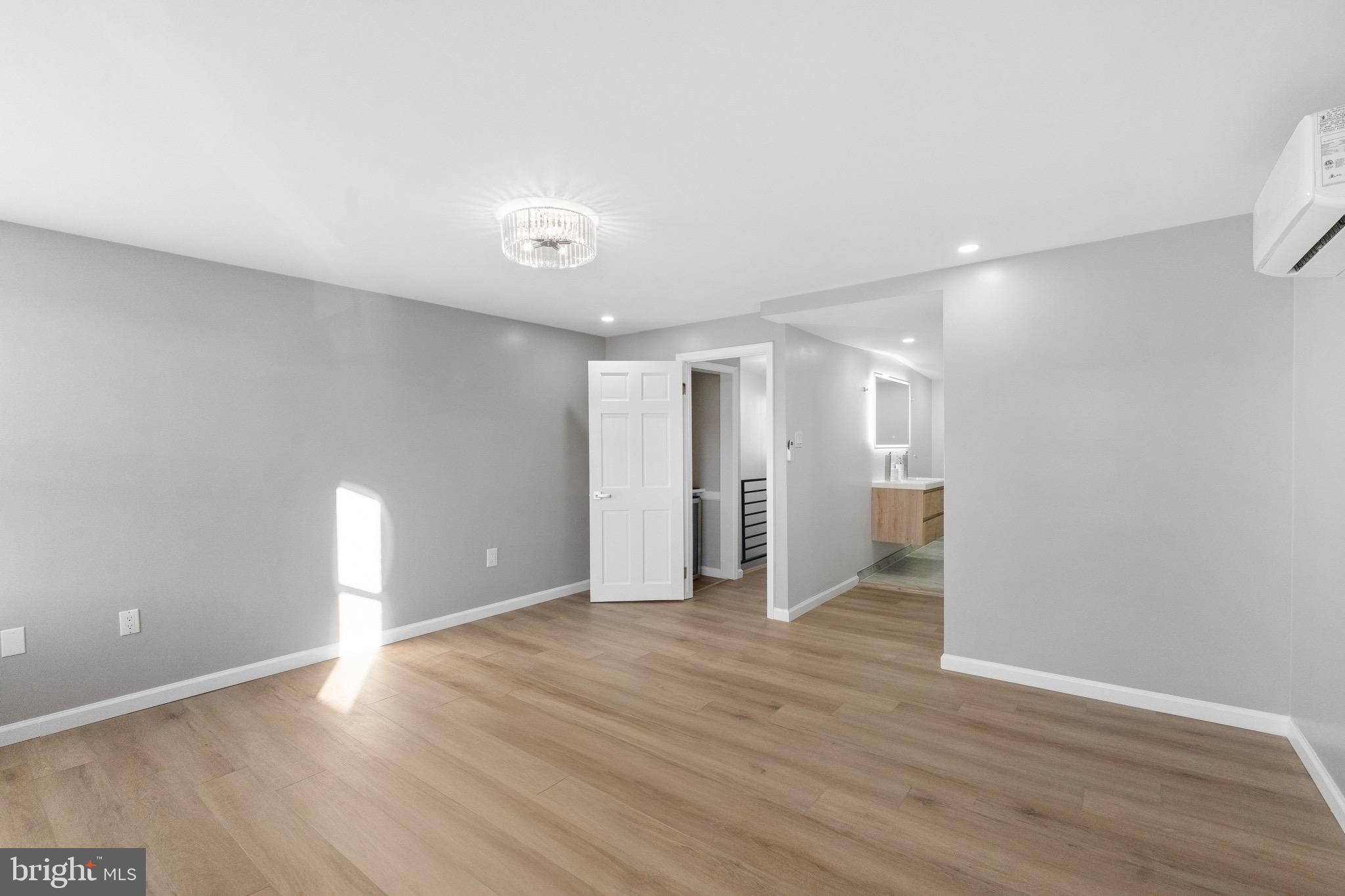1203 Moore Street Philadelphia, PA 19148 - Photo 39 of 41 a view of an empty room with wooden floor