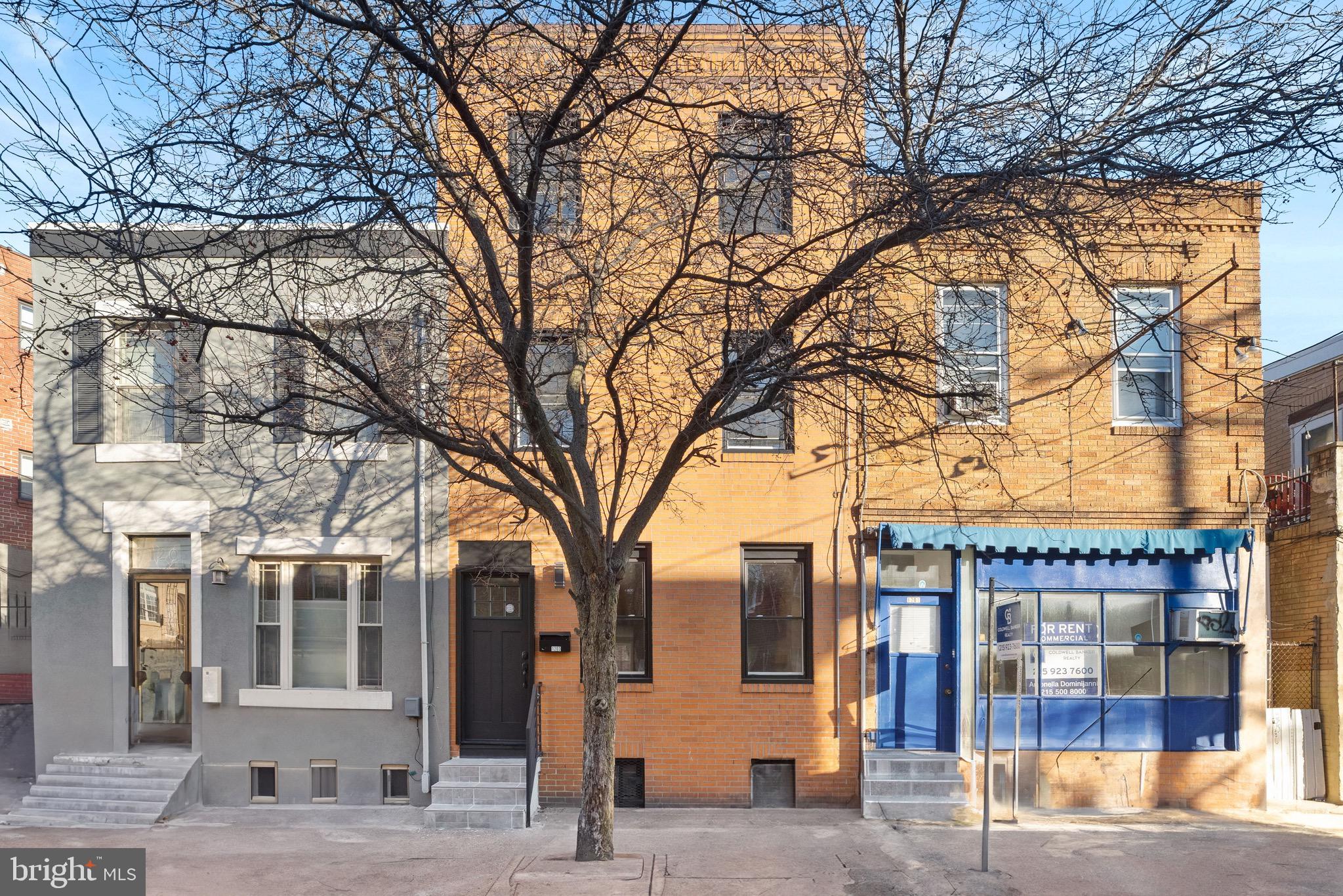 1203 Moore Street Philadelphia, PA 19148 - Photo 5 of 41 a view of a building with a trees