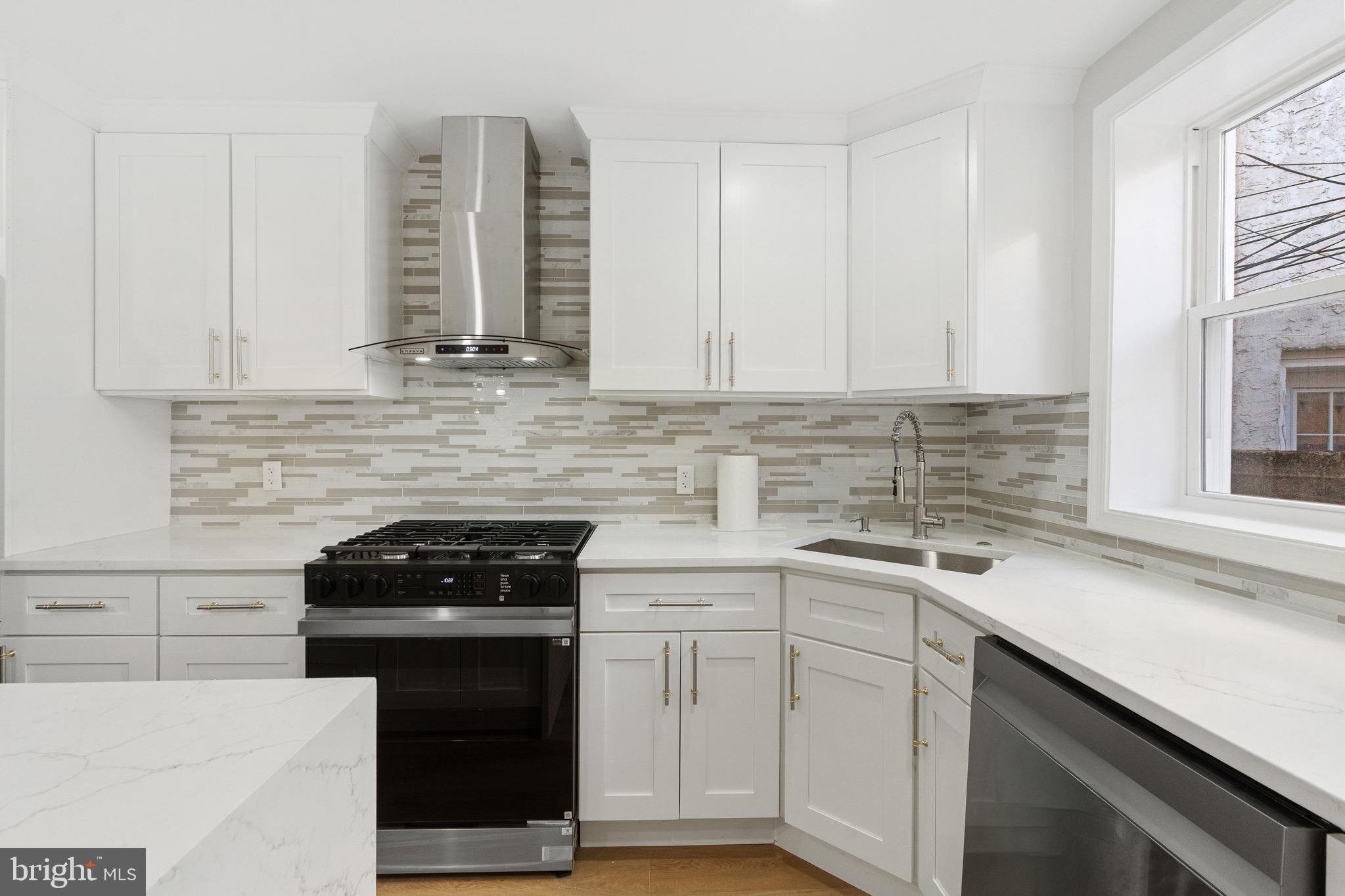 1203 Moore Street Philadelphia, PA 19148 - Photo 7 of 41 a kitchen with appliances cabinets and a sink