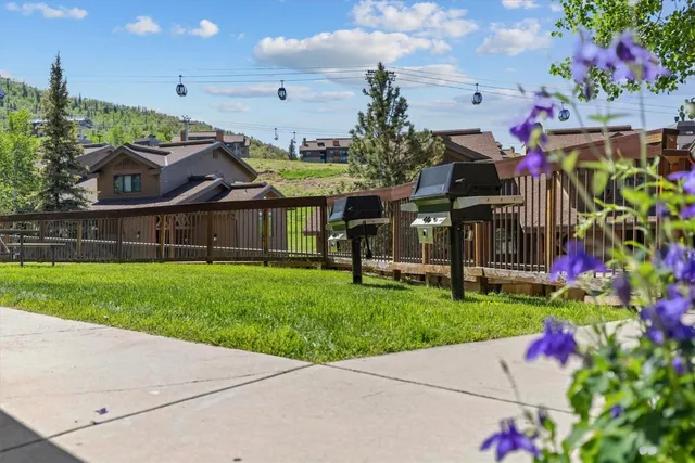 a view of a swimming pool with a yard
