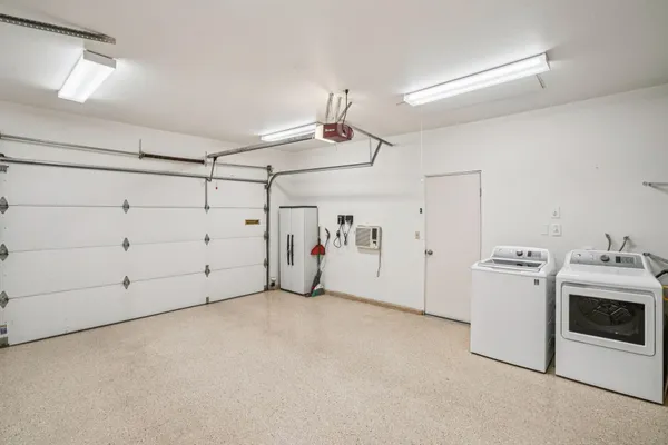 a view of a storage & utility room with washer and dryer