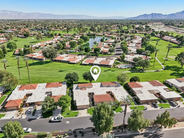 an aerial view of a house with a garden