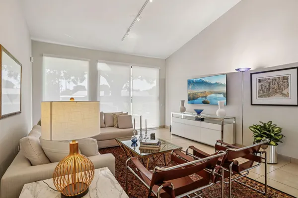 a living room with furniture and a large window