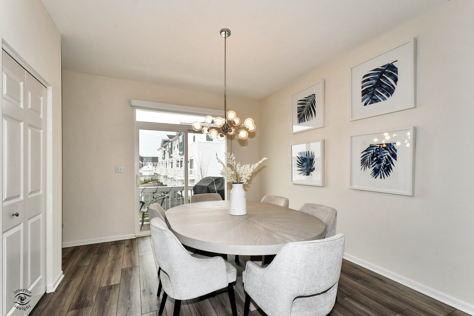 4154 Irving Road Aurora, IL 60504 - Photo 12 of 25 a view of a dining room with furniture wooden floor and a chandelier