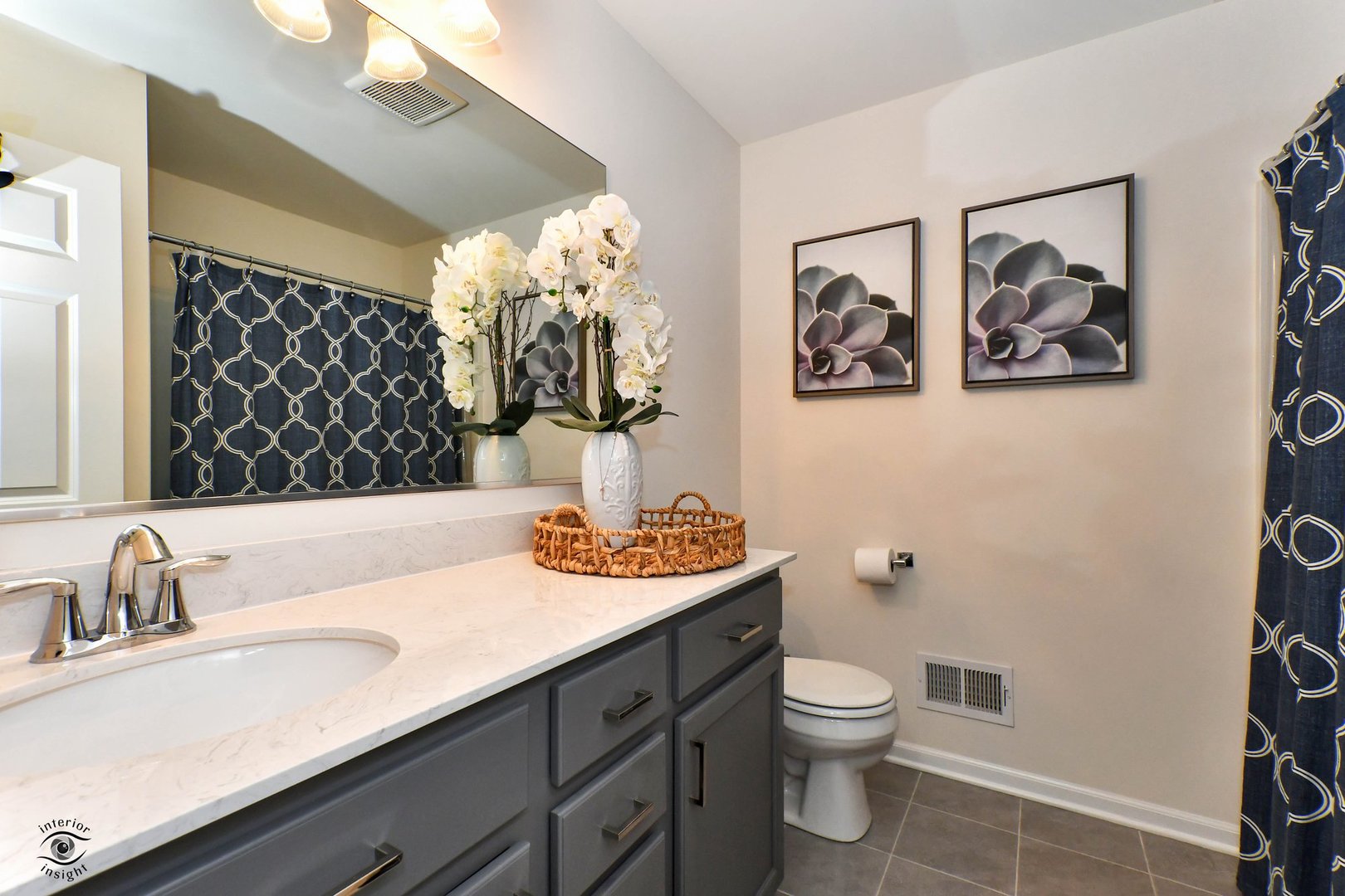 4154 Irving Road Aurora, IL 60504 - Photo 22 of 25 a bathroom with a sink a toilet and a mirror