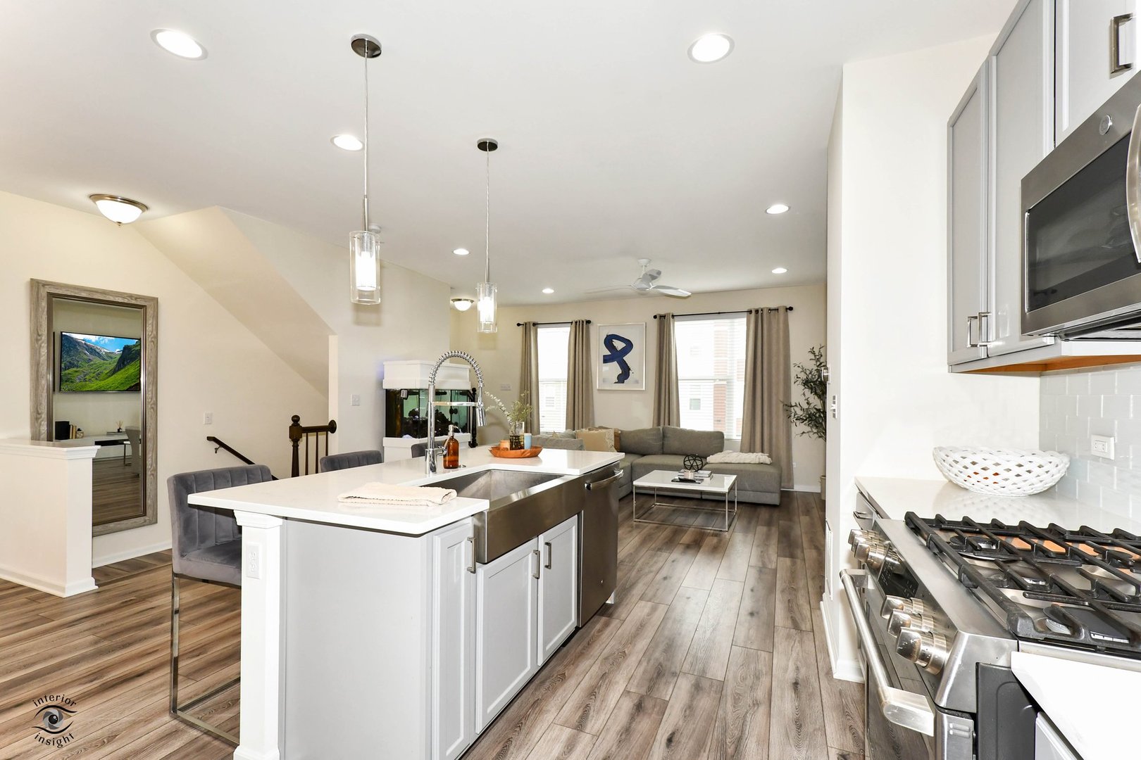 4154 Irving Road Aurora, IL 60504 - Photo 7 of 25 a open kitchen with sink stove and wooden floor