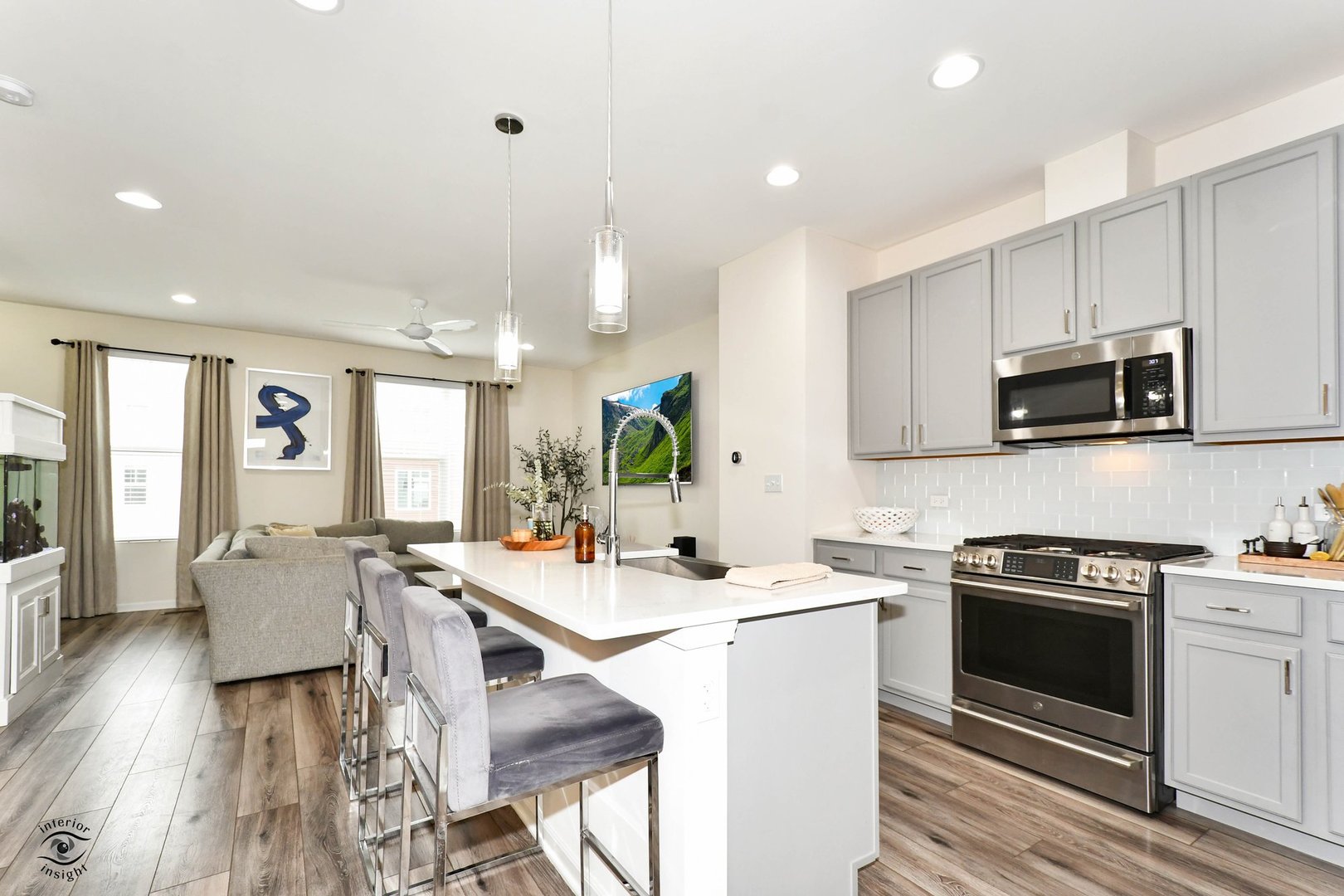 4154 Irving Road Aurora, IL 60504 - Photo 8 of 25 a kitchen with stainless steel appliances a stove a sink a microwave a refrigerator and cabinets