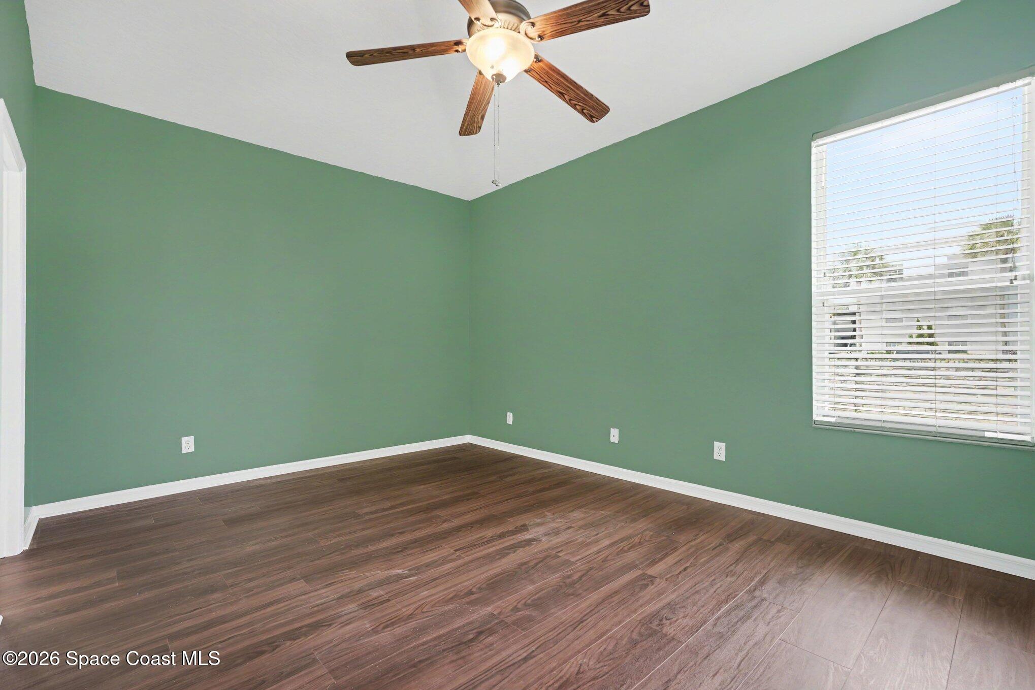 284 Intrepid Way Indialantic, FL 32903 - Photo 21 of 36 a view of room with window and wooden floor