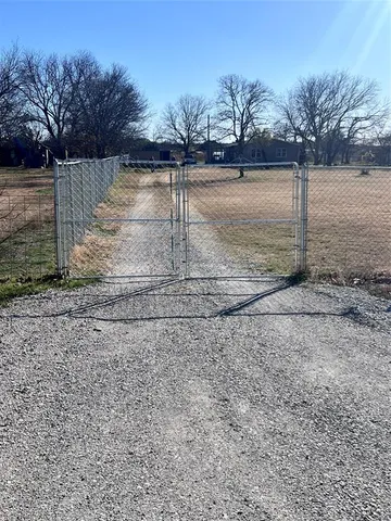 a view of a yard with trees