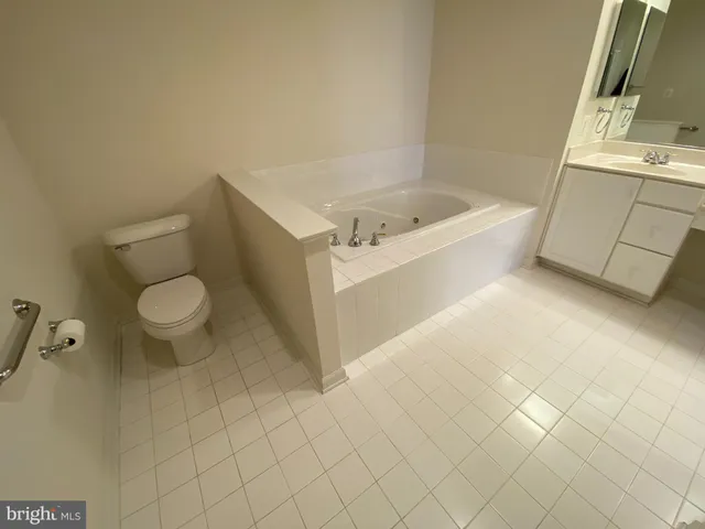 a bathroom with a sink a toilet and bathtub