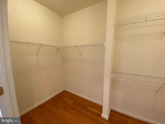 a view of a small space with wooden floor