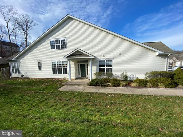 a view of a yard in front of a house with a yard