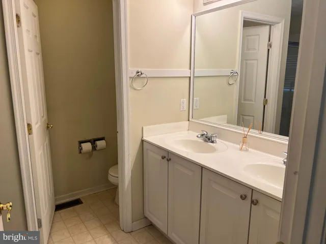 a view of an empty room with a fireplace